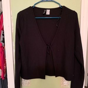 Black cover up, long sleeve, short top with tie